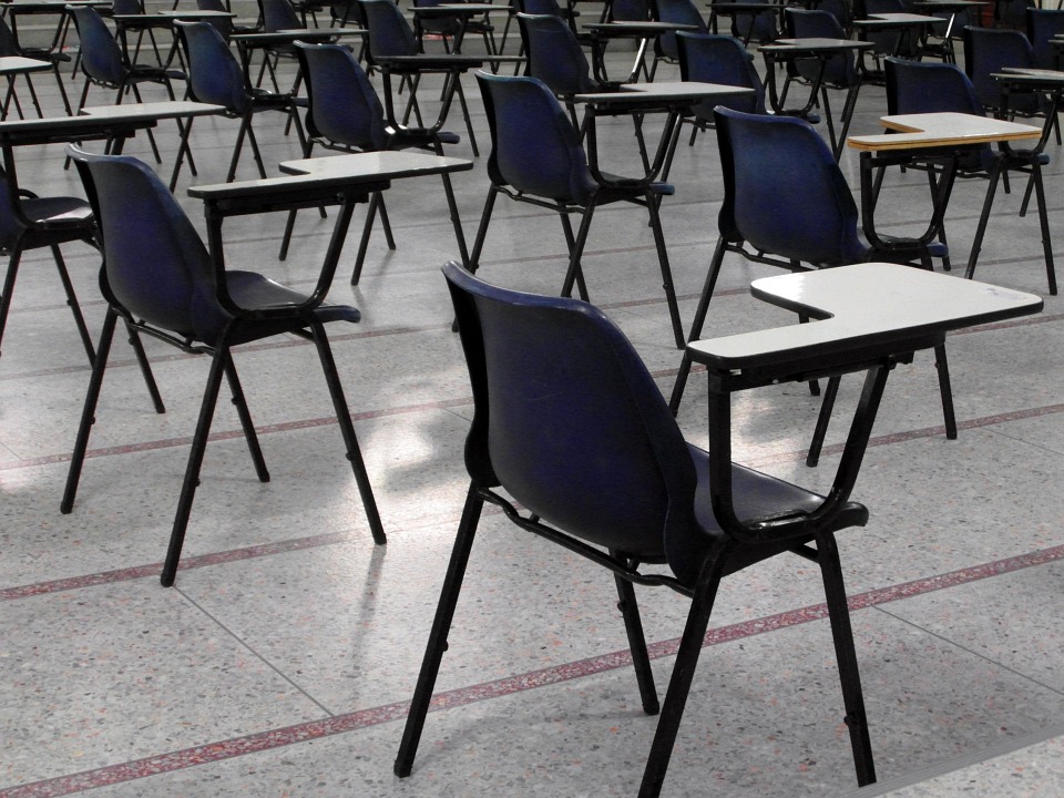 Picture of empty tables in an exam hall